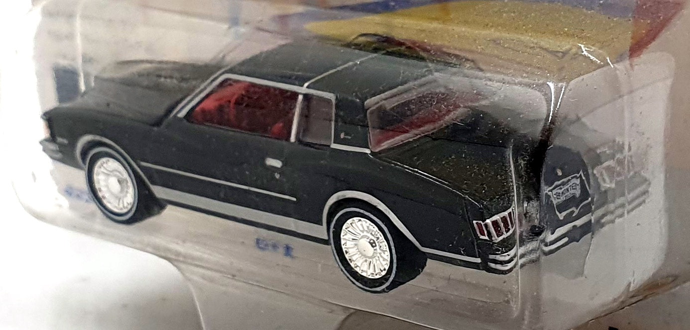 Johnny Lightning 1/64 JLMC028 - 1978 Chevrolet Monte Carlo - Black/Red Interior