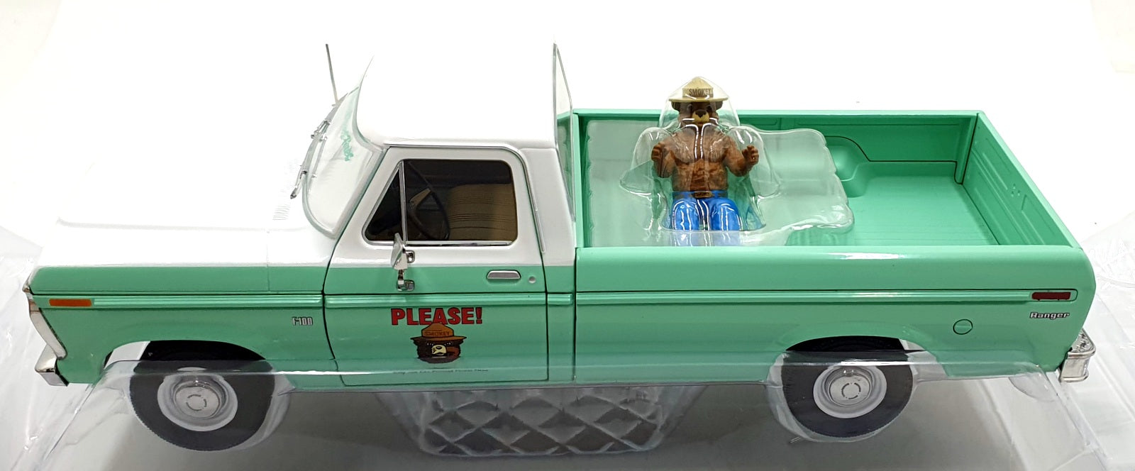 Greenlight 1/18 Scale 13636 - 1975 Ford F-100 w/ Smokey Bear Figure - Turquoise