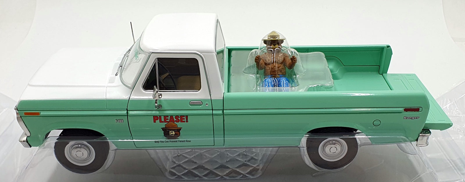 Greenlight 1/18 Scale 13636 - 1975 Ford F-100 w/ Smokey Bear Figure - Turquoise