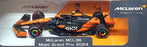 Burago 1/43 Scale 18-38451 - F1 McLaren MCL38 Diorama Miami GP 2024 Norris