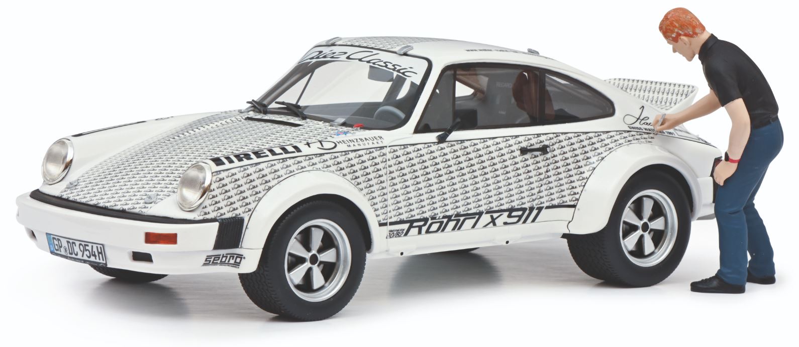 Schuco 1/18 Scale Diecast 450024900 - Porsche 911  Rorhl x 911 With Figure